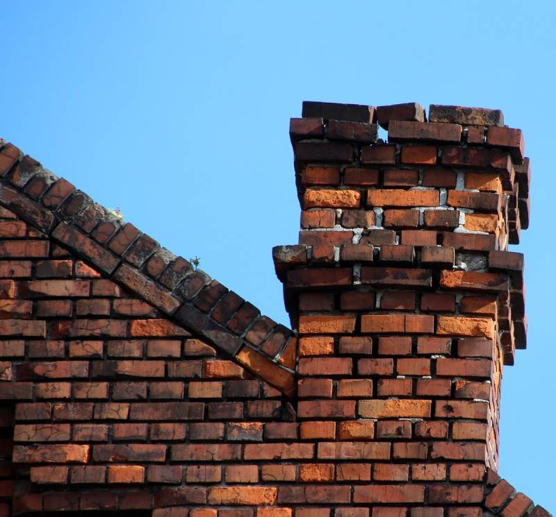 Signs Your Waukegan Home Needs a Chimney Inspection Damaged chimney on an Waukegan home showing cracks and missing mortar